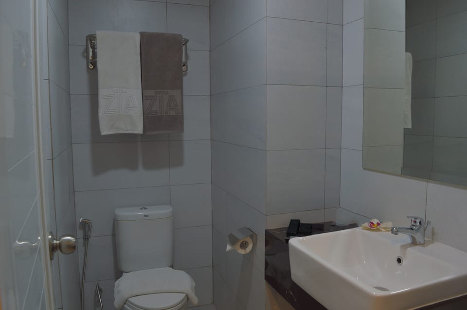 Shower, free toiletries, slippers, towels