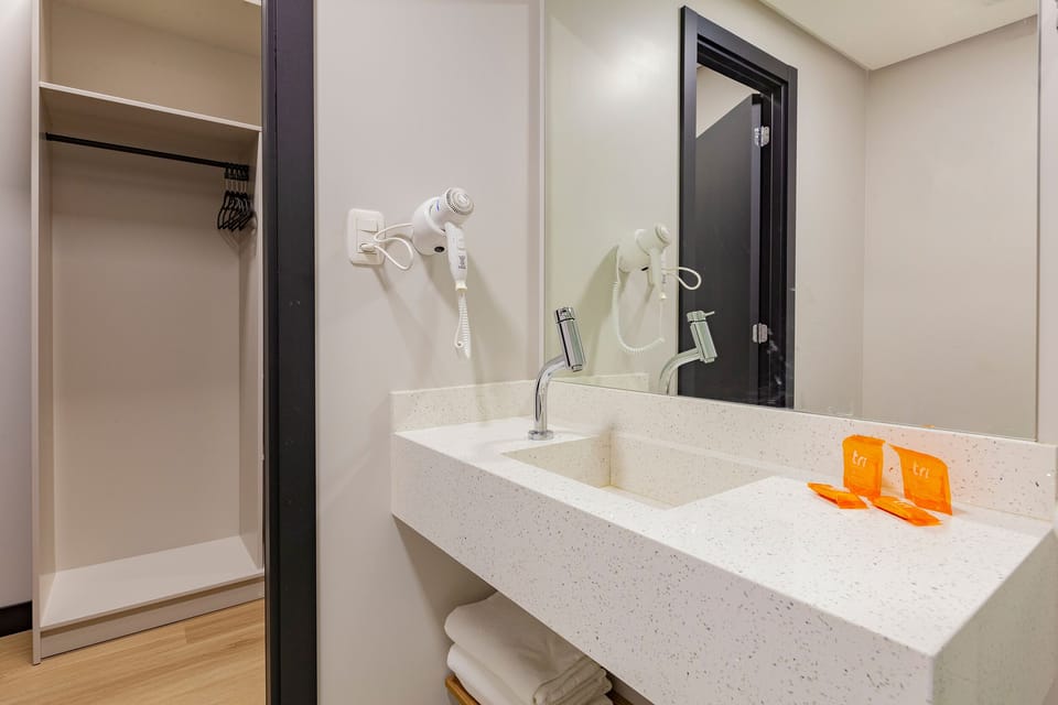 Shower, rainfall showerhead, designer toiletries, hair dryer