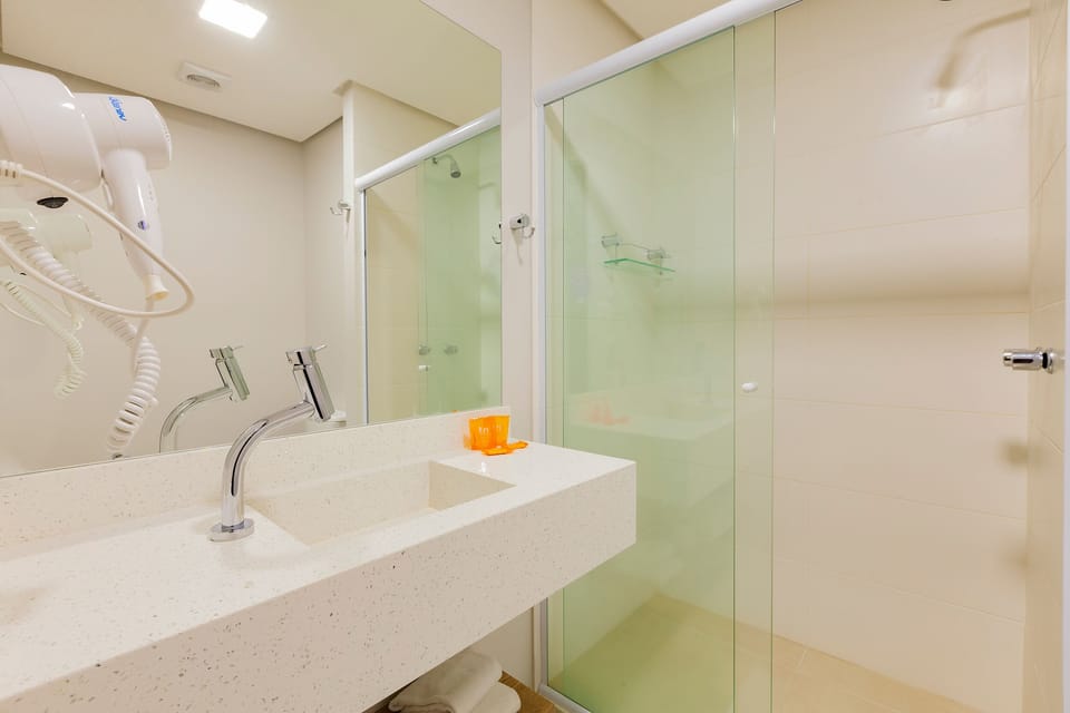 Shower, rainfall showerhead, designer toiletries, hair dryer