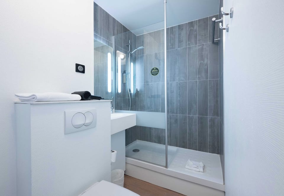 Shower, towels, soap, toilet paper
