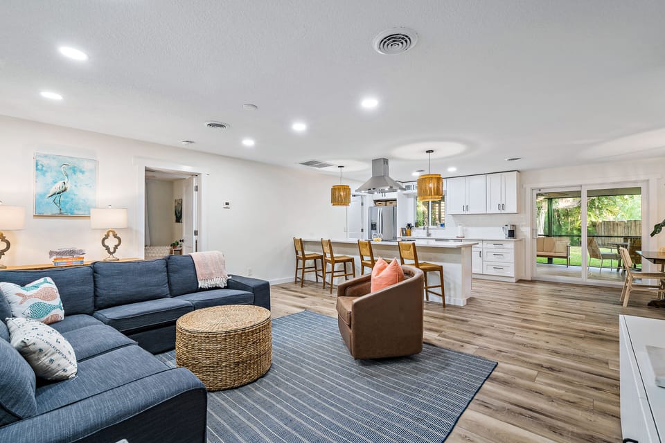 Open concept living and dining area with easy access to outdoor living area. 