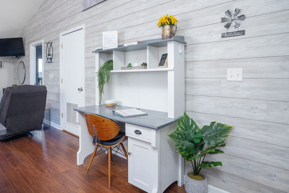 Get ready to bloom and swoon at our reading table! Dive into your favorite book amidst the charming company of a flower vase.