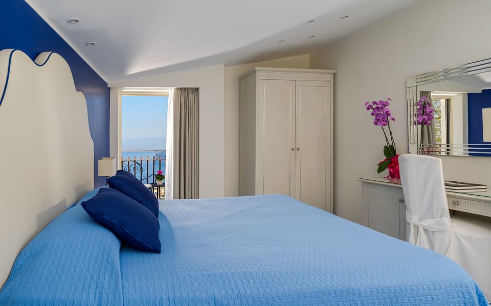Deluxe Room, Terrace, Sea View | Down comforters, in-room safe, desk, blackout drapes