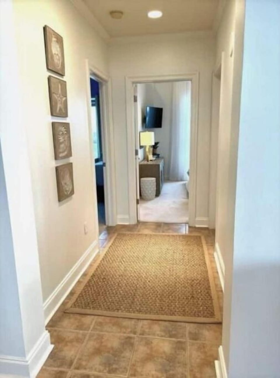 Hallway to 2nd and 3rd bedrrooms and laundry room