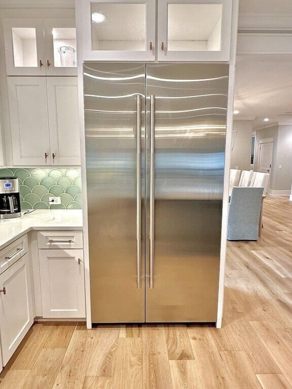Large stainless steel fridge / freezer unit.