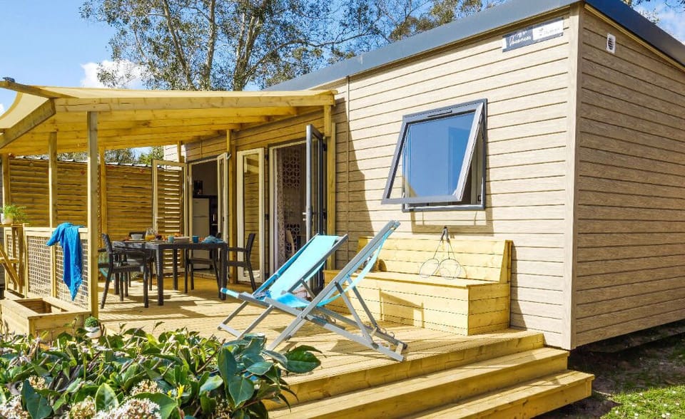 Relax on the sunny deck, complete with comfortable seating and a peaceful atmosphere.