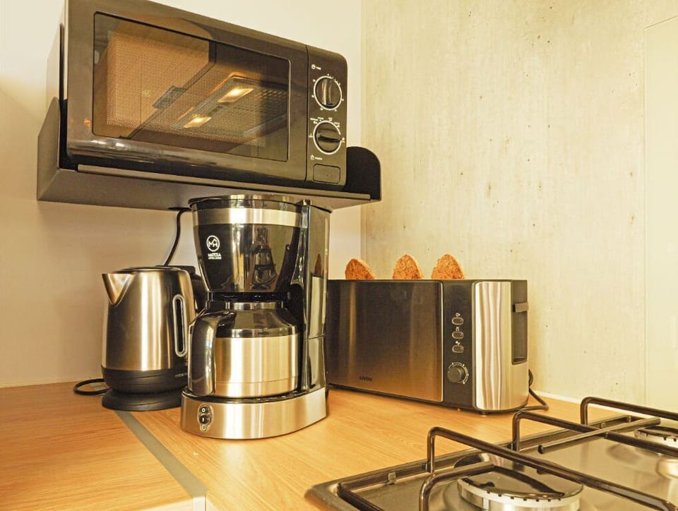 Compact kitchen essentials, perfect for morning coffee and quick meals.