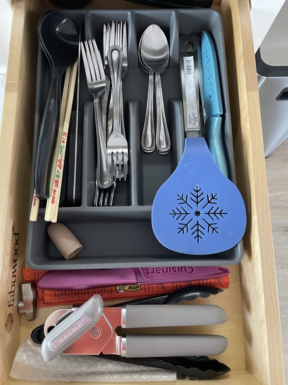 Can opener, cutlery, tongues, knives, chop sticks