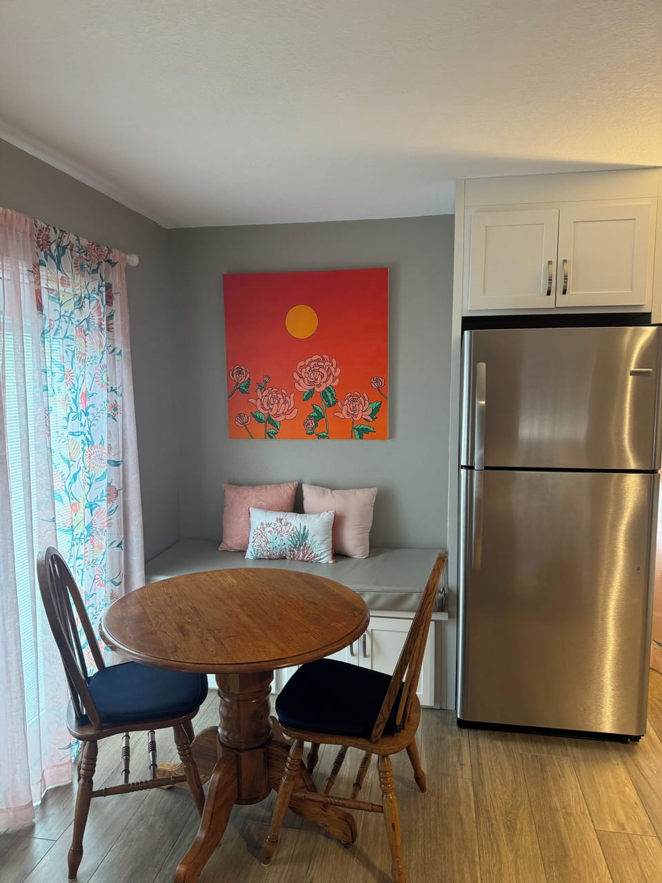 Table with seating for 4. Full sized refrigerator with ice maker.