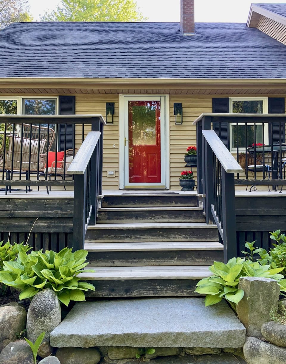 Enjoy a cozy chair for sunset on your front porch of Ironwood Glade.