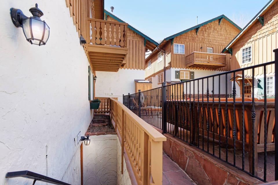 The stairwell down to your condo is conveniently located adjacent to the pool, hot tub, bbq and patio area.