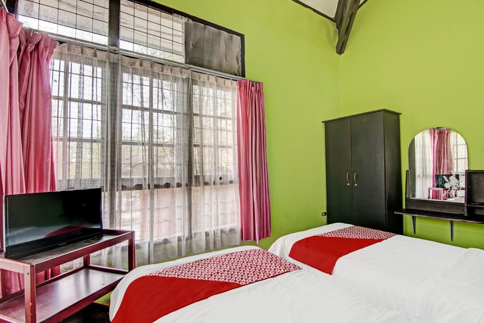 Desk, laptop workspace, bed sheets