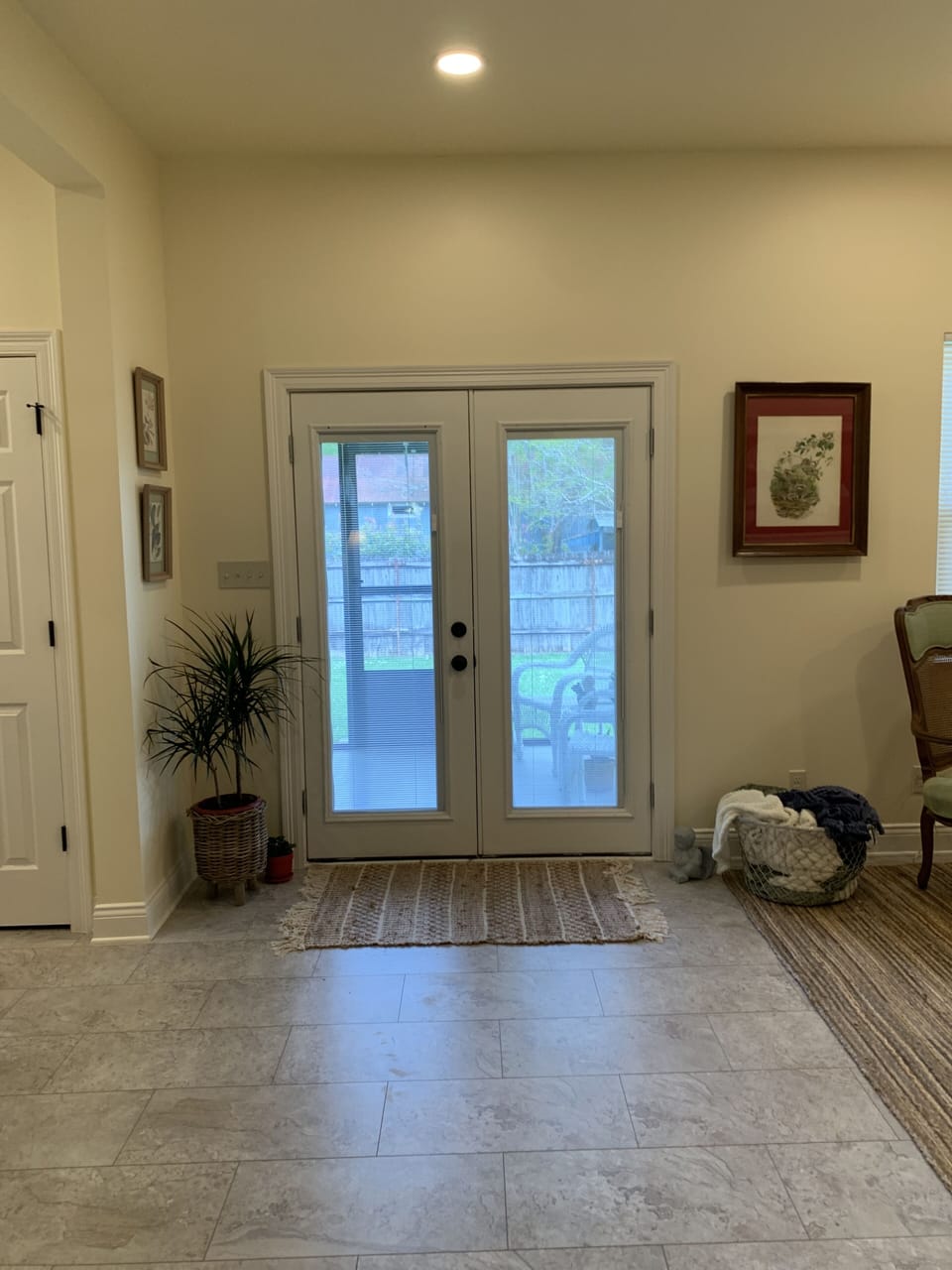 French doors open to screened porch