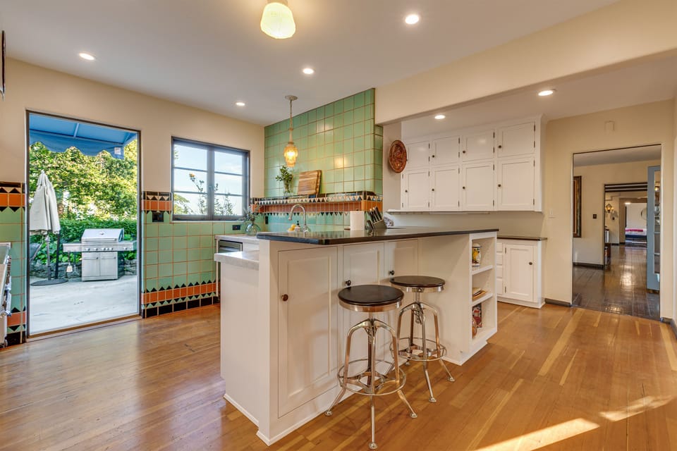 View out to the gas grill, as well as through the butlers pantry and into the formal dining room