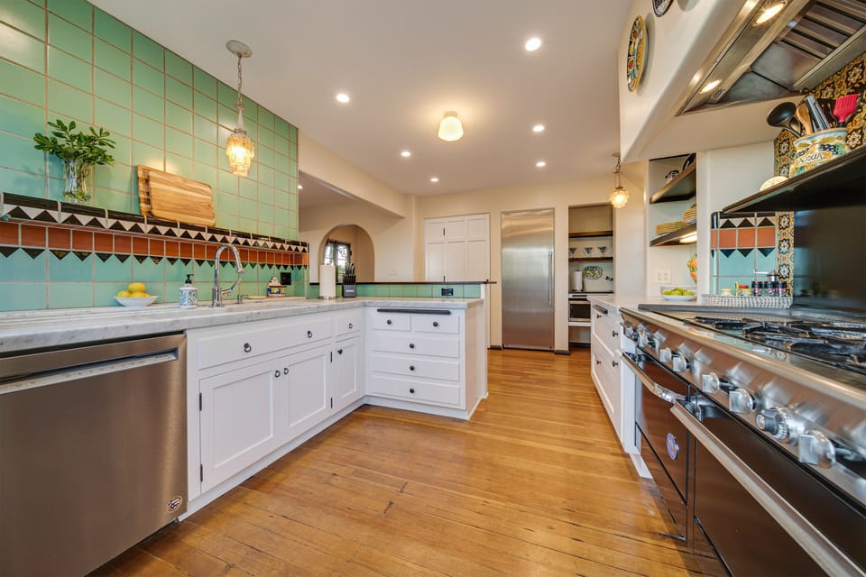 Professional gas rang, dishwasher, extra large fridge and more in this expansive kitchen that leads to the private pool and spa