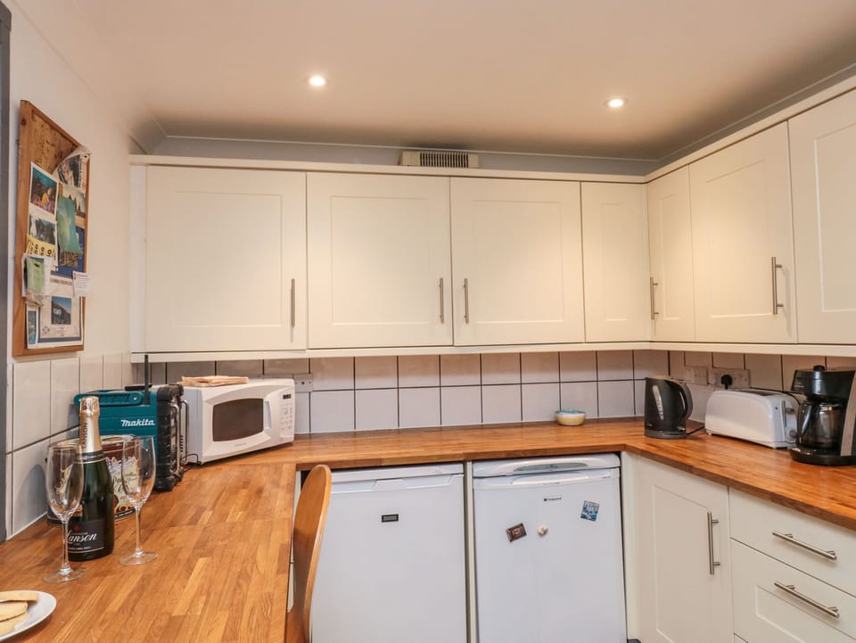 Fridge, electric kettle, toaster, cookware/dishes/utensils