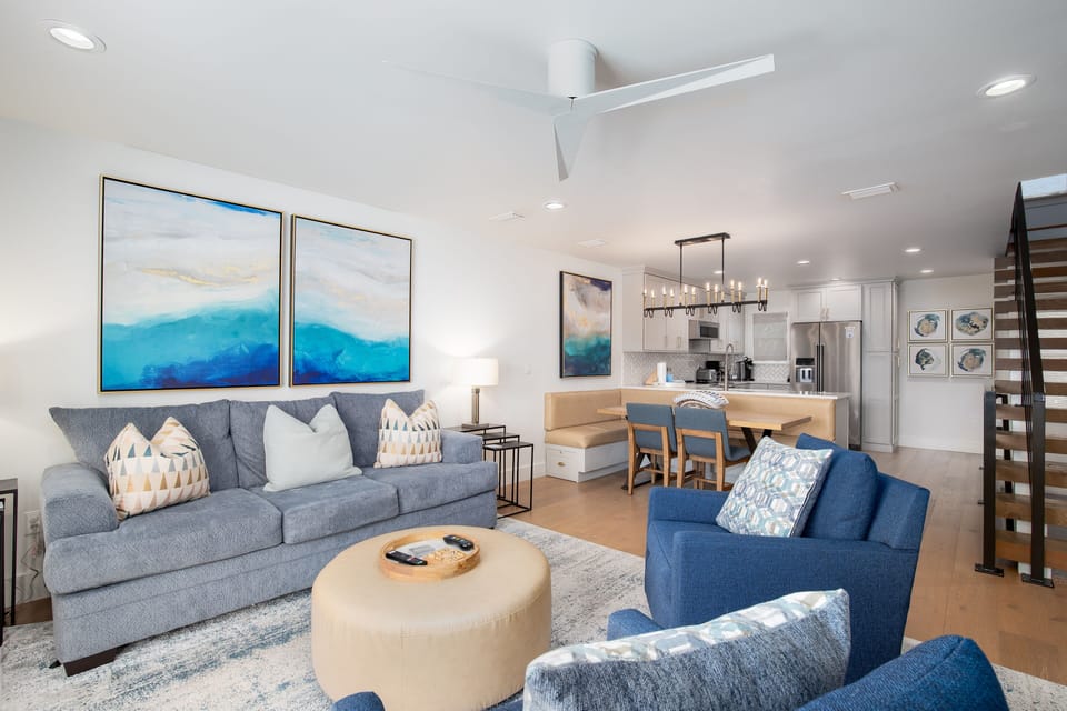Relax in your stylish open-concept living space with ocean-inspired blues and modern comfort throughout.