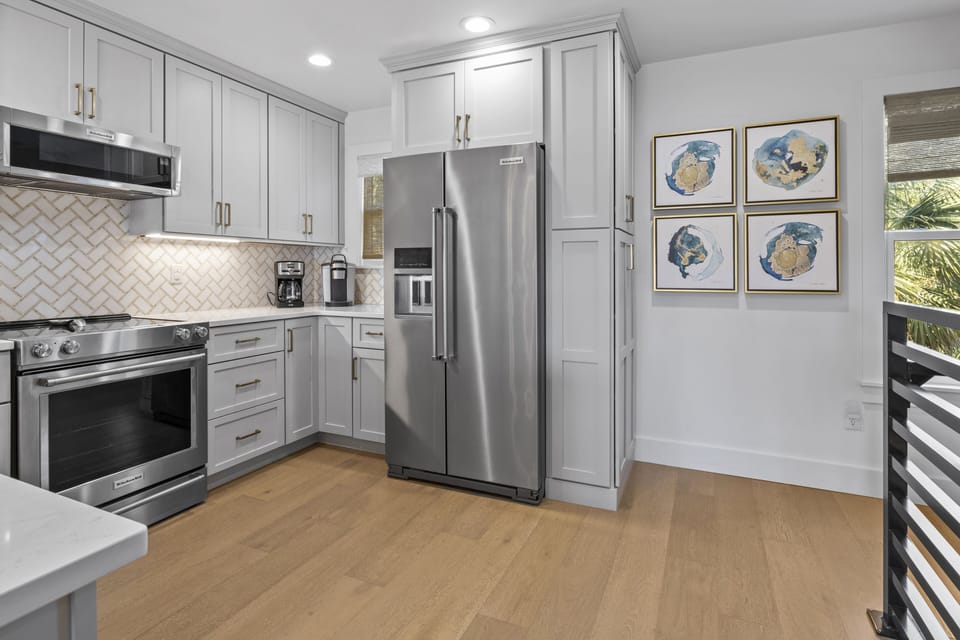 Your fully equipped kitchen features stainless steel appliances and elegant cabinetry, perfect for preparing meals during your stay.