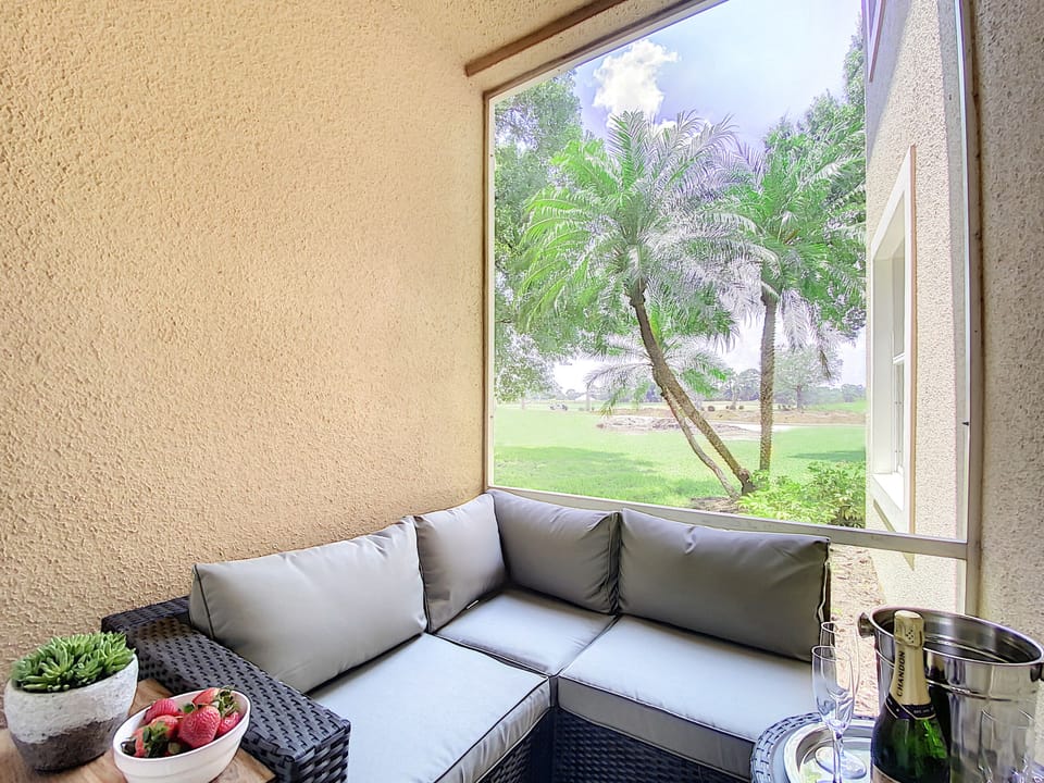 Chic Patio Oasis: Lounge with TV, PGA views - your retreat in style awaits.
