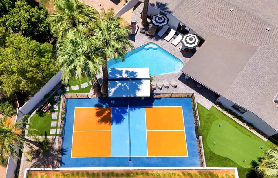 From pickleball matches to pool lounging, outdoor movie nights, grilling feasts, and putting practice — this custom-designed backyard is a one-of-a-kind retreat for endless relaxation and entertainment.