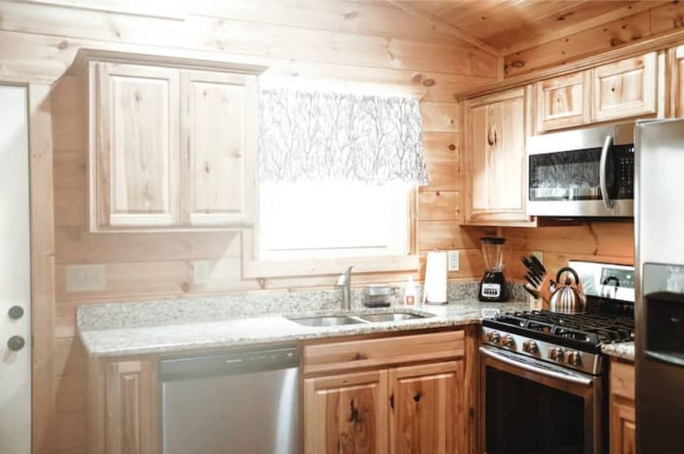 Kitchen with sun coming through window :) Sometimes you'll see deer out there :)