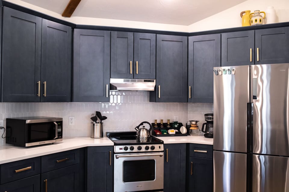 Closeup view of the beautiful blue kitchen cabinets.