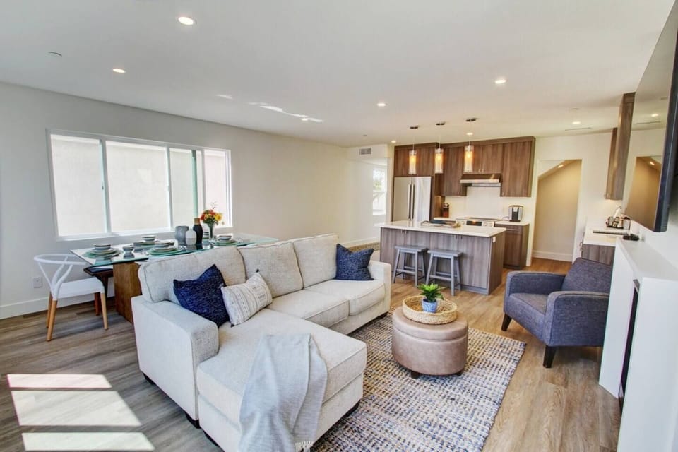LIving room with comfortable sofa and sitting chair. 