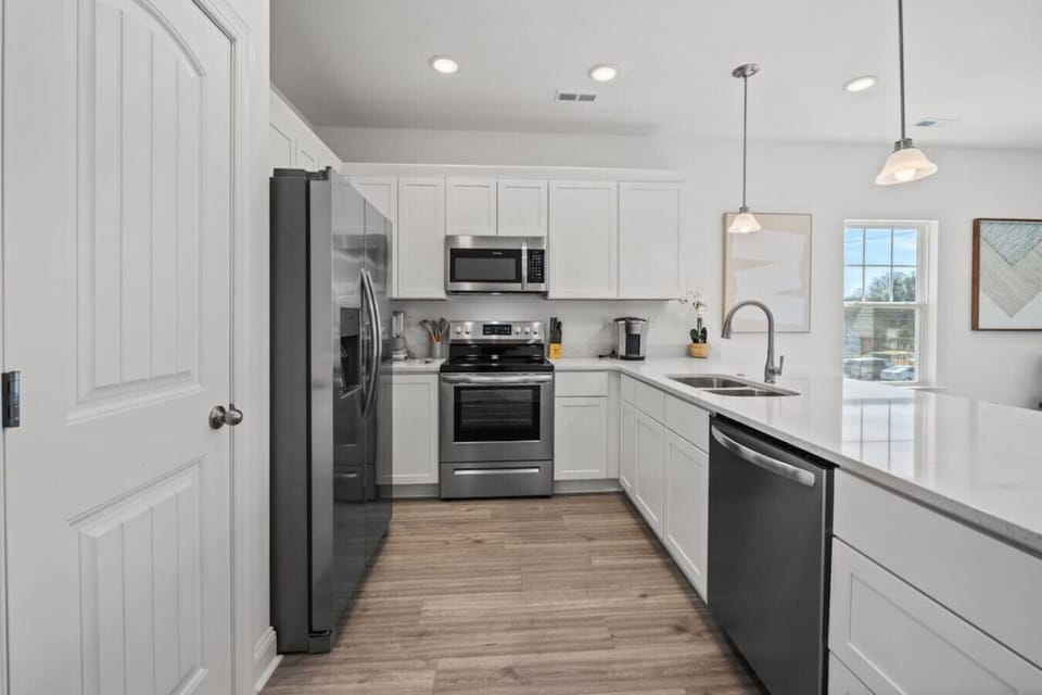 Fully equipped kitchen with sleek appliances & plenty of counter space