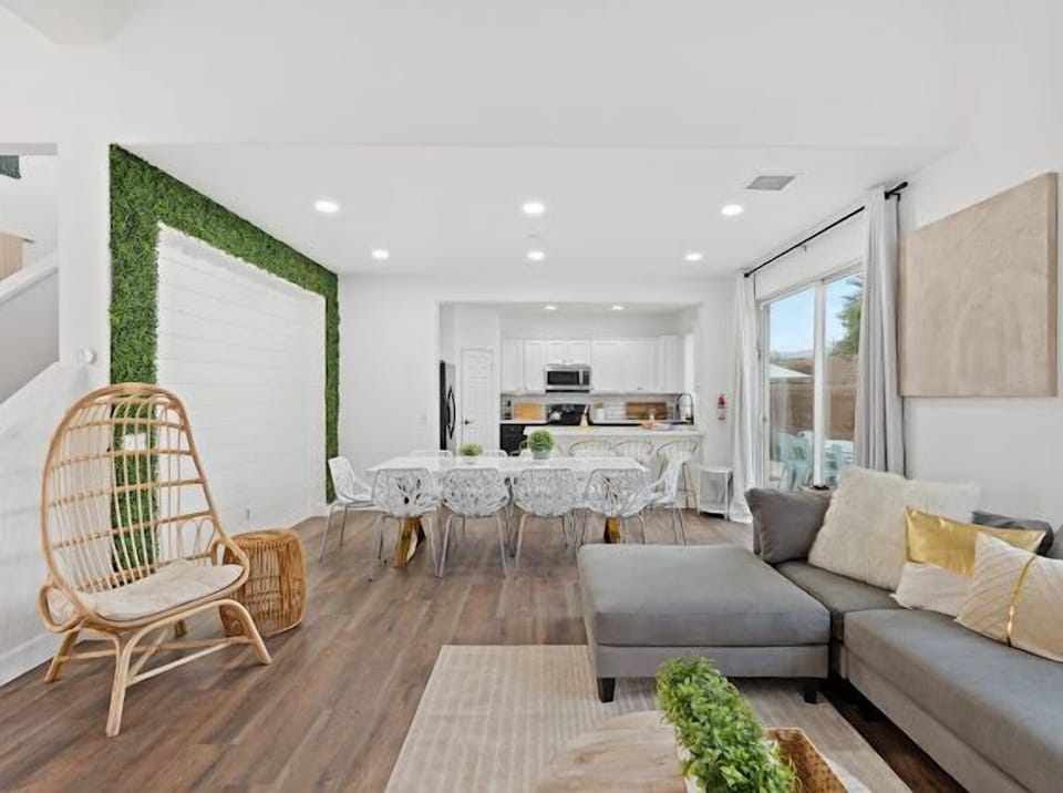 Open concept living room with rattan cacoon chair 