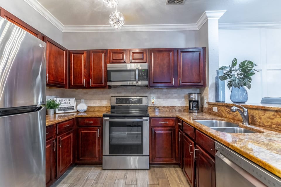 Kitchen Offers Easy Access to All Main Area Rooms - Dining Room and Living Area