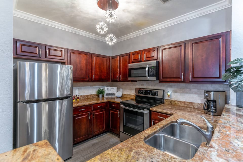 Modern Kitchen Features Stainless Steel Appliances, Granite Countertops and Loads of Cabinet Space