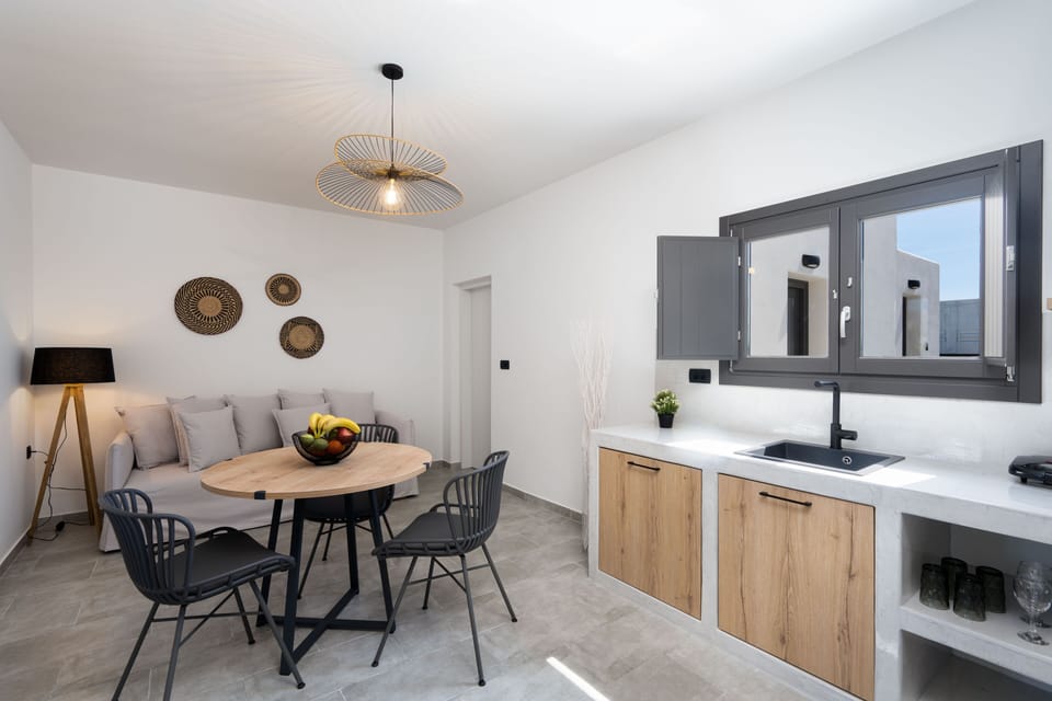 Suite, 1 Bedroom (Aithra) | Living area | 42-inch Smart TV with satellite channels, TV, fireplace