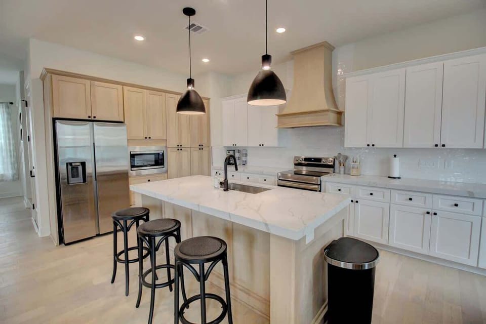 The kitchen is fully stocked with everything you might need to make your favorite meals. In the meantime- Sit at the bar and crack open a couple of cold ones! 