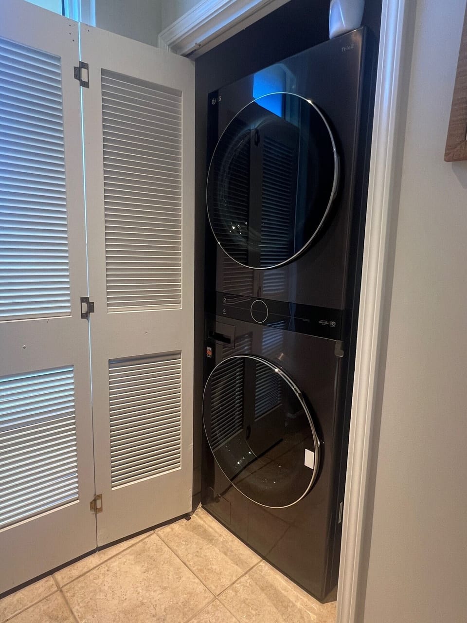 1/2 bathroom has a brand new stacked washer/dryer