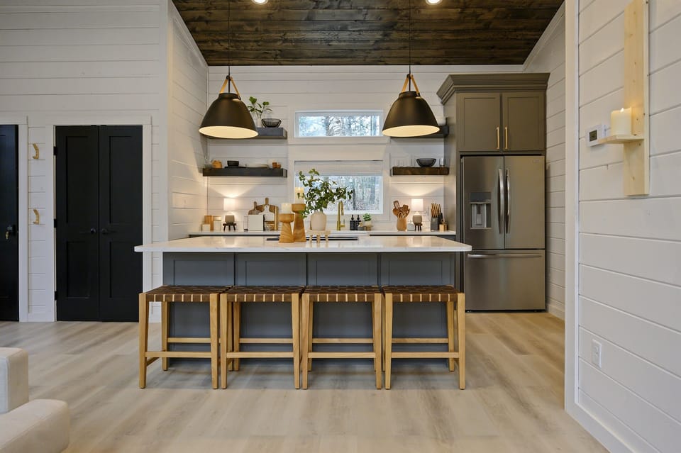 Whip up a romantic meal in the fully equipped kitchen with modern amenities and a Nespresso machine with frothier