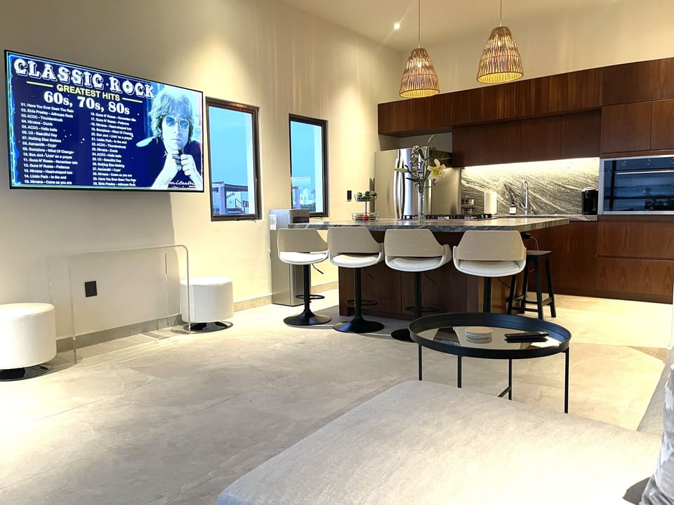 Living room and kitchen with 60 inch TV