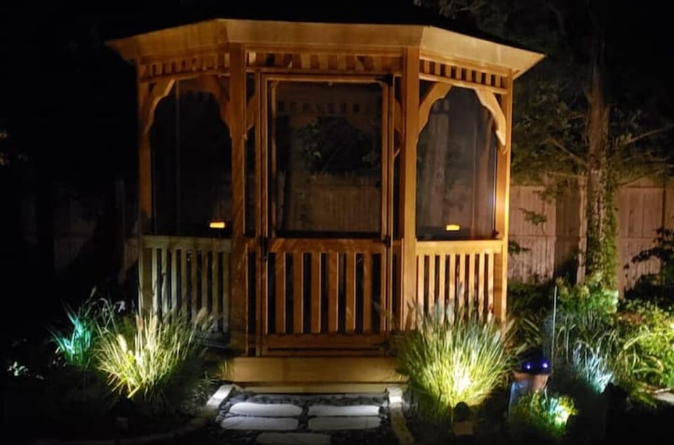 Delightful screened gazebo for morning coffee or evening cocktail. 