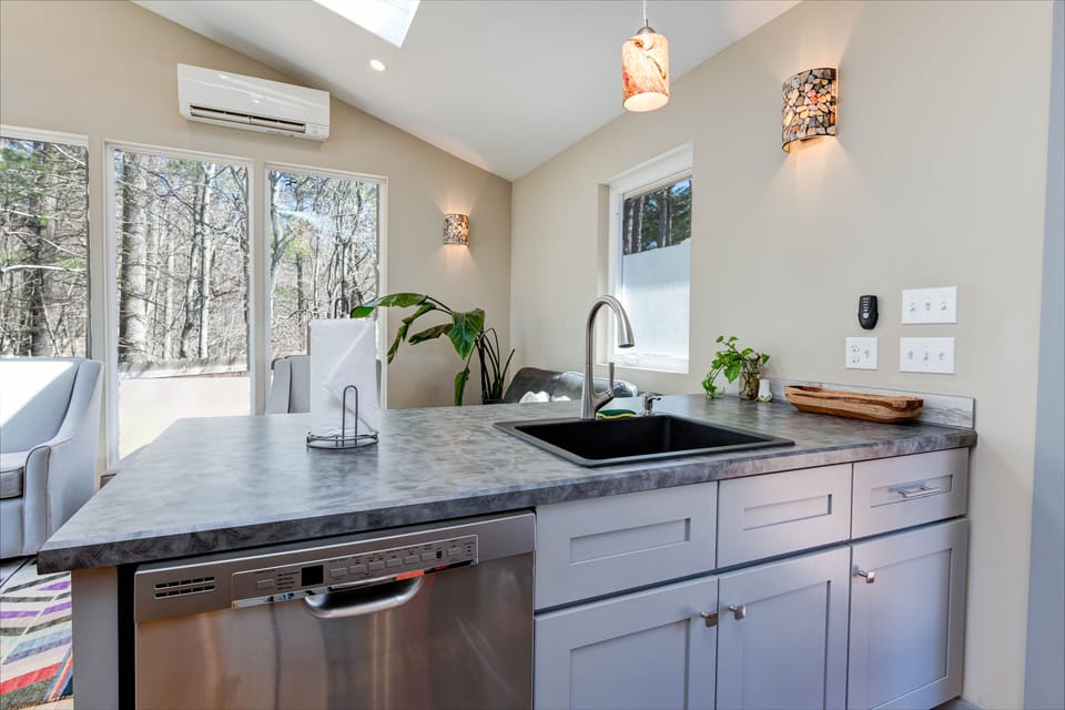 A modern kitchen and living space perfect for small groups.
