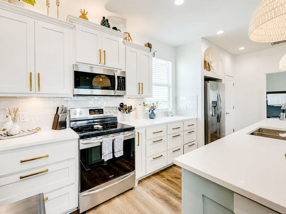 Fully equipped kitchen with stainless steel appliances, custom cabinets, and spacious countertops in Crystal Beach TX vacation home.