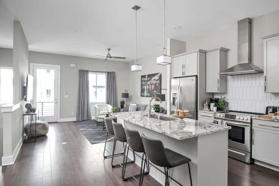 Cook up a storm in this stylish space w/ sleek finishes & inviting bar seating!