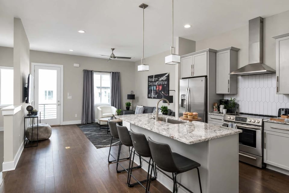 Cook up a storm in this stylish space w/ sleek finishes & inviting bar seating!