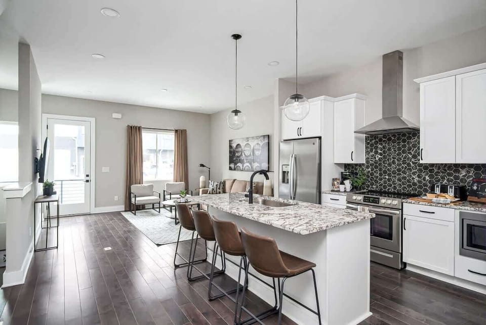 Cook up a storm in this stylish kitchen with modern finishes and ample seating!