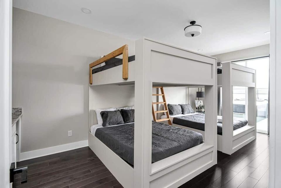 Bedroom 8 - Custom built side by side bunk beds with queen mattresses.
