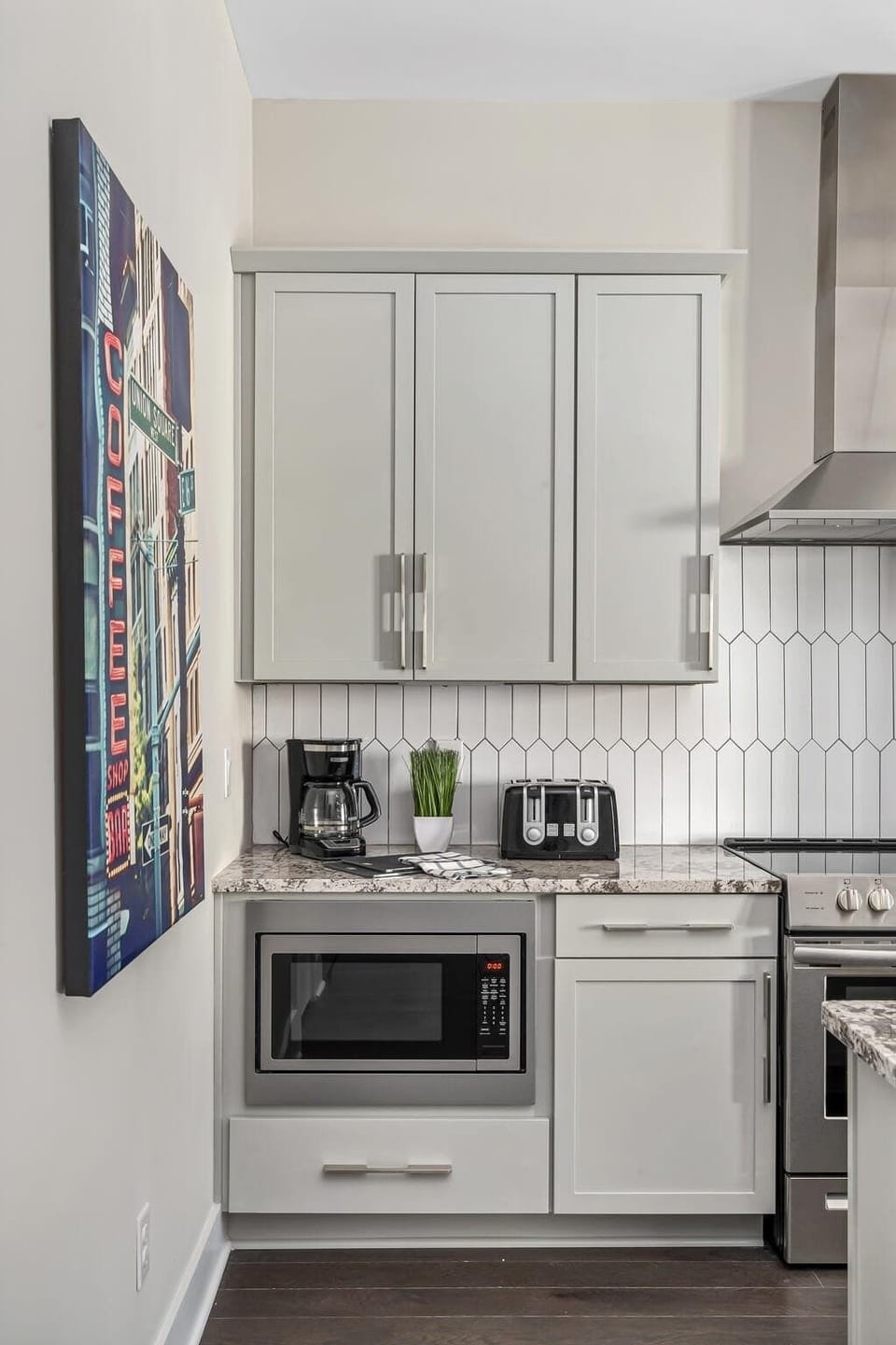 Fully equipped kitchen with sleek stainless steel appliances.