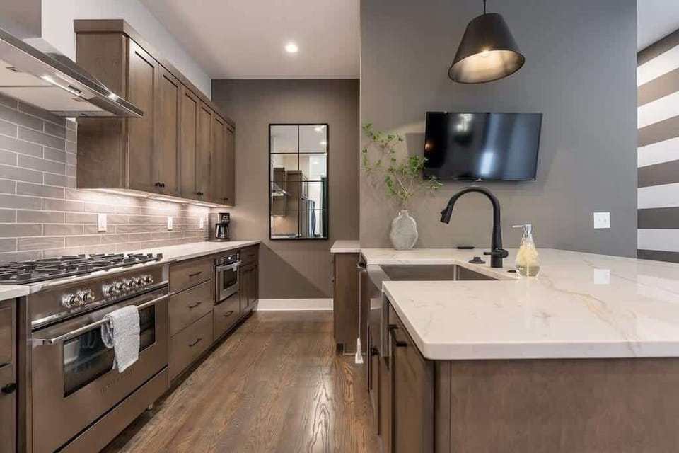 Enjoy a complete kitchen setup with island and essentials.