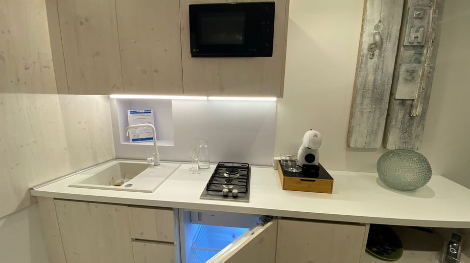 Espresso maker, coffee/tea maker, full-size fridge, microwave