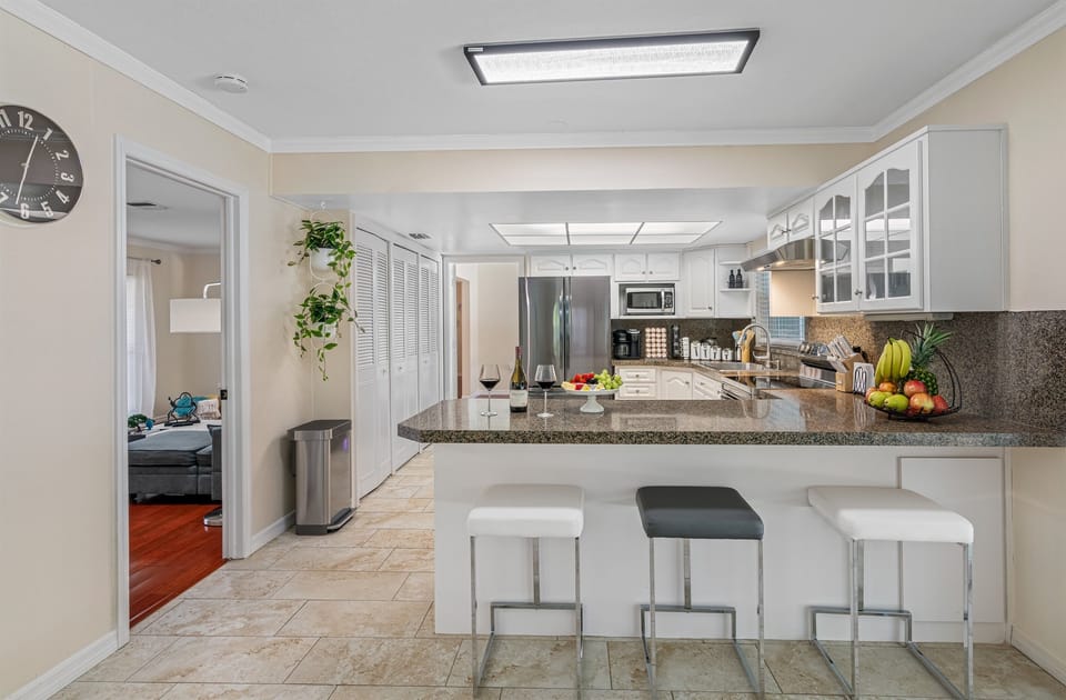 Crisp, clean lines and modern finishes make this kitchen a true showstopper, while still maintaining a warm and welcoming vibe.