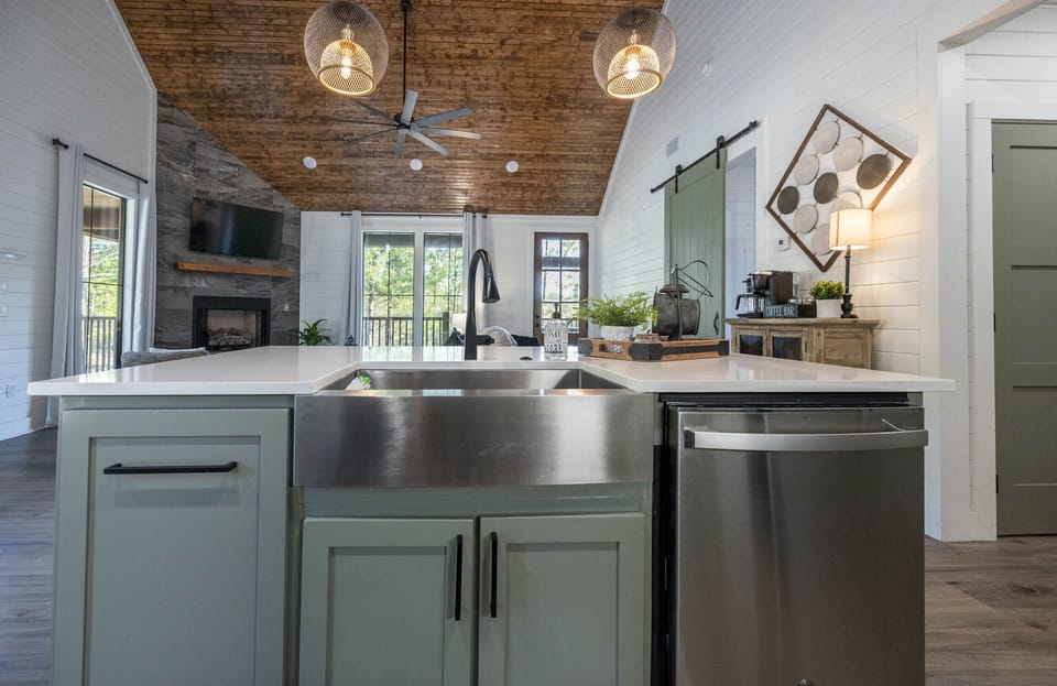 Spacious farmhouse-style sink with a built-in garbage disposal, along with a dishwasher.