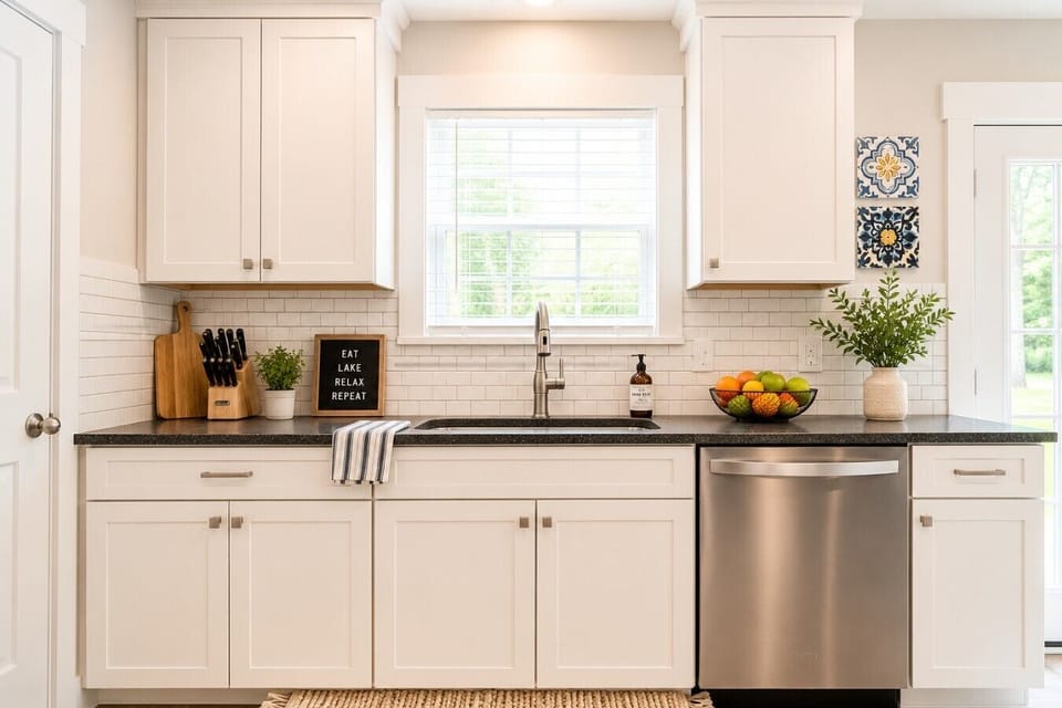 Modern, fully equipped kitchen with stainless steel appliances, coffee maker, cookware, and all the essentials needed to make yourself at home during your stay.