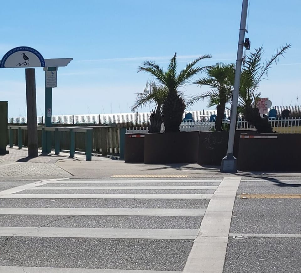 Convenient beach entrance right across the street, shared with adjacent resort